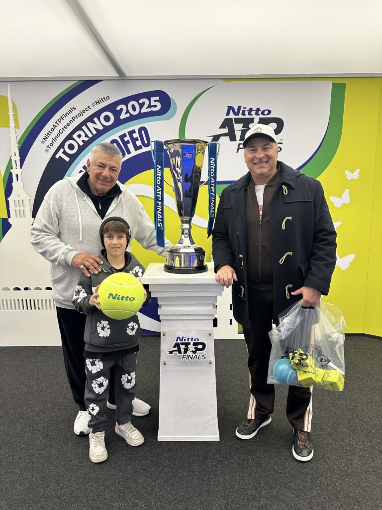 My father, son and I, at the Nitto ATP Finals, 2025, with the trophy.